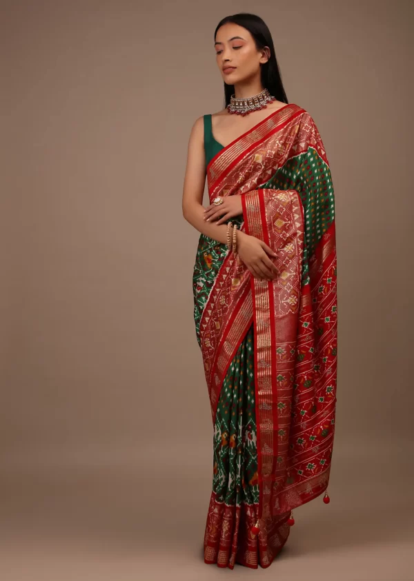 bottle_green_saree_in_silk_with_multi_colored_patola